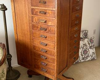 Antique revolving 40 drawer storage unit.