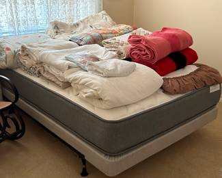 Beautiful linens including quilts and wool blankets.