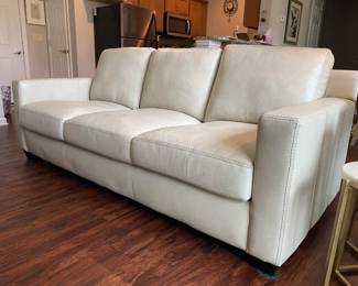 Incredible Anaheim Collection Raymour and Flanigan  top grain leather couch, over 50% off and in supreme condition, colored ivory