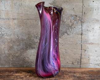 A large iridescent carnival glass vase made by Schmitz and Dan Jurkovich in 1993. The vase is signed and dated on the base.