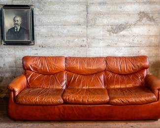 Brown leather mid-century style couch