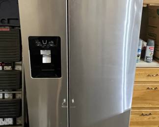New Whirlpool side by side fridge/freezer with ice/water dispenser (door handles available but not installed)
