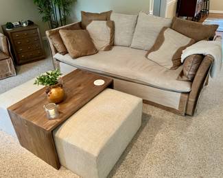 Leather trimmed living room set with loveseat, armchair, footstool and coffee table