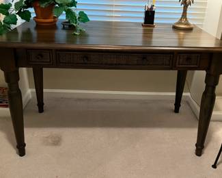 Wood desk with rattan accents