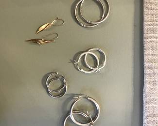 silver hoop earrings, gold dangle earrings