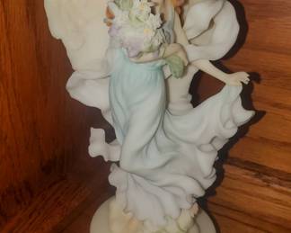
Item #84242, date stamped 2000.  2001 Limited Edition Figure with Base and Lily sculpture.