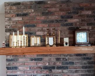 Baldwin brass candlesticks of various sizes; mantel clock
