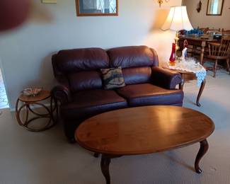 Loveseat with coffee table and matching end table (there are 2); brass lamp (again, there are 2) 