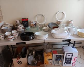 12 place settings plus extras of Tradition Delphi china;  Corning bakeware; numerous Wilton cake pans; All-Clad utensil set