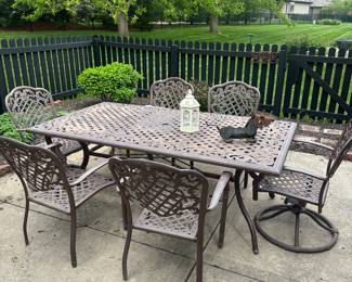 2 rockers, 4 chairs, table 
There are cushions, not displayed b/c weather 