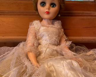 Vintage dolls with assortment of clothes