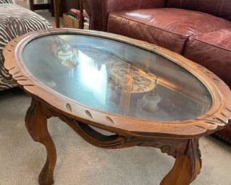 Carved table with removable glass top