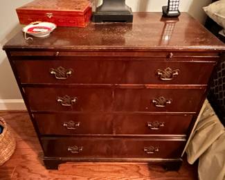 4 drawer mahogany chest with pull out writing surface 