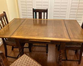 Antique oak draw leaf table with leaves extended and barley twist legs