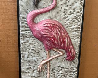 Several flamingos including blow ups, wire standing and other decorative ones