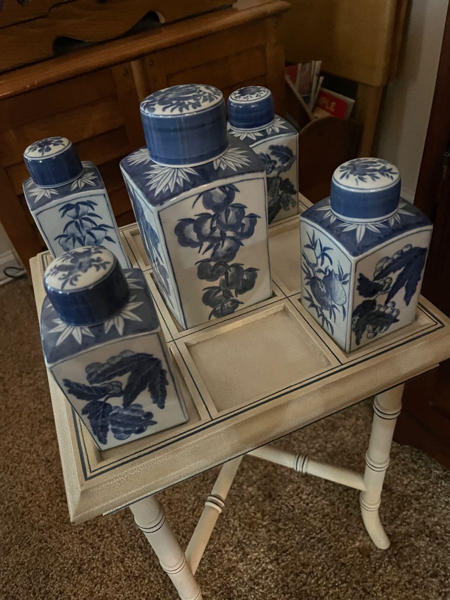 Asian table with 5 blue and white lidded jars