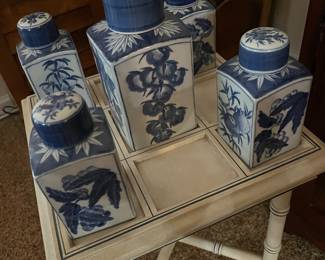 Asian table with 5 blue and white lidded jars