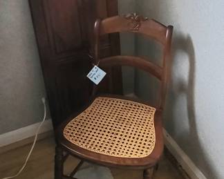 Antique chair with rattan seat and 2 raised panel shutters