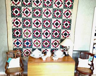 Overall view drop-leaf table.  Two vintage/antique chairs.  Ironstone Pottery.  Beautiful Quilt.
