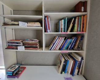 $2, $5, $10+ Books on shelves above sewing/craft table