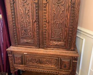 #1	Late 1800s Wood Heavily Carved Ornate Sideboard w/2 doors and 1 drawer & shelf (one drawer pull off but included with the piece for repair) 33x14.5x62 - Shipped over from Italy by a Polish General	 $750.00 
