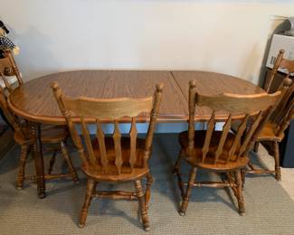 #6	Wood Dining Table w/2 leaves and 4 wood chairs   53-74x41x29	 $175.00 
