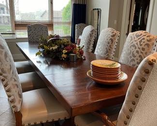Large Wood Dining room table with 10 Studded and Upholstered Chairs