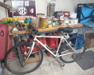 Schwinn Bicycle, cans of house paint, workbench