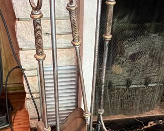 Hammered metal fireplace tools by Janice Minor