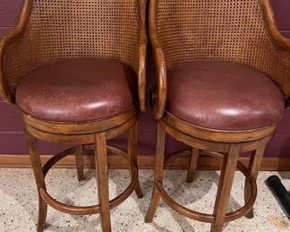 Rattan swivel stools with leather seats
