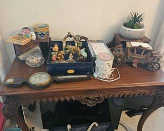 Antique desk eary 1800s, topped with antiques.