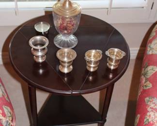Antique side table with some sterling pieces on top