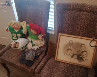 See cabbage patch dolls--football player w helmet and the other doll is a cheerleader