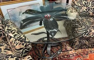 Glass top table with steel lily base