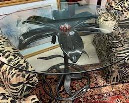 Glass top table with steel lily base