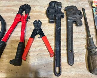 Bolt cutters, pipe wrenches, screw driver.