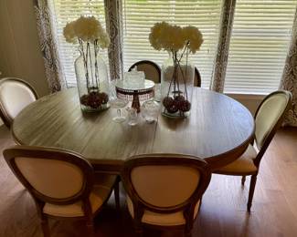 newer dining table with 6 chairs covered in linen-like material, pair of large glass vases with artificial flowers, Waterford crystal rose bowl, mustard jar,& compote