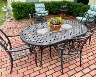 nice cast aluminum patio table with 4 chairs