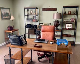 metal and wood office desk and bookshelves, leather office chair