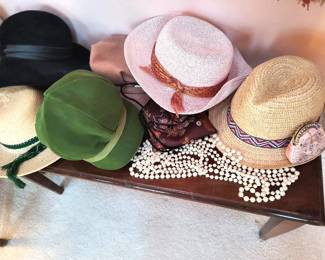 Variety of fashionable hats and jewelry.
