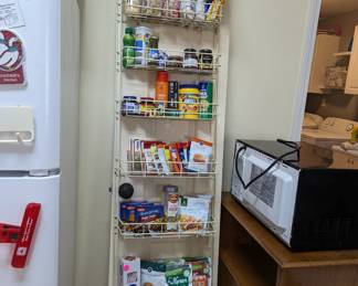 LOTS of Spices and packaged food items - yes, the microwave and cart is for sale.