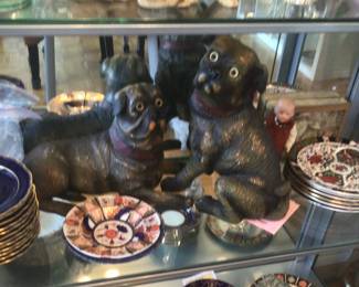 Pair of slip cast dog figures with glass eyes