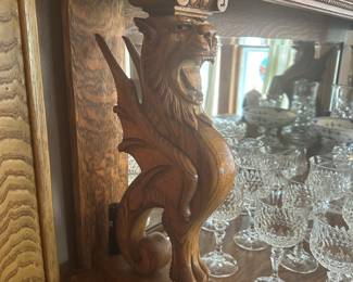 Close up of Griffins on sideboard.  German stemware in background.
