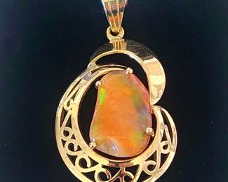 Very large 14kt gold pendant with beautiful Ethiopian opal.