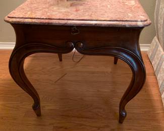 one of two matching end tables with pink Belgian marble tops