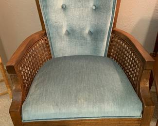 blue upholstered chair with woven cane sides