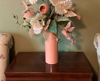 nightstand and pink floral arrangement