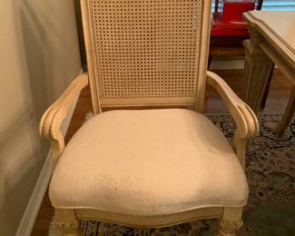 chairs are upholstered seats and cane backs