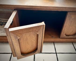 Vintage MCM coffee table with center cabinet and caning on both sides