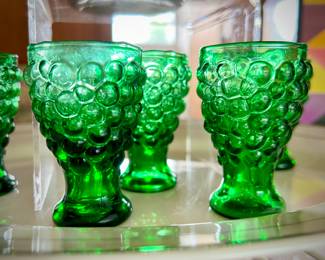 Vintage 1960s green grape decanter and shot-glass cork, with five shot glasses